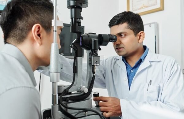 Indian,Serious,Optometrist,Working,With,His,Patient,He,Using,Special